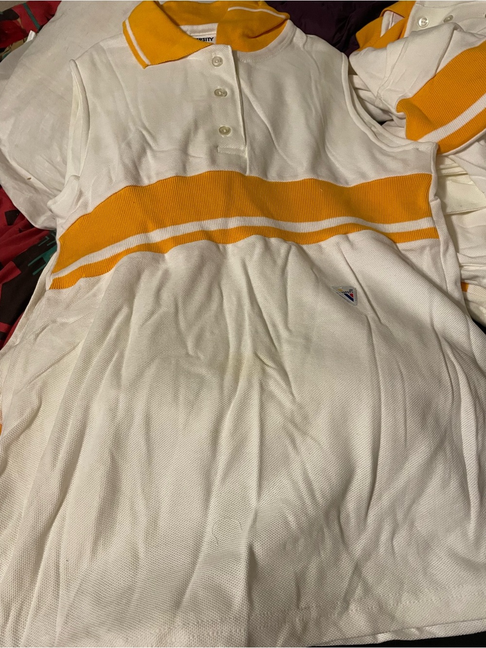Varsity White Polo with Bold Yellow Stripe